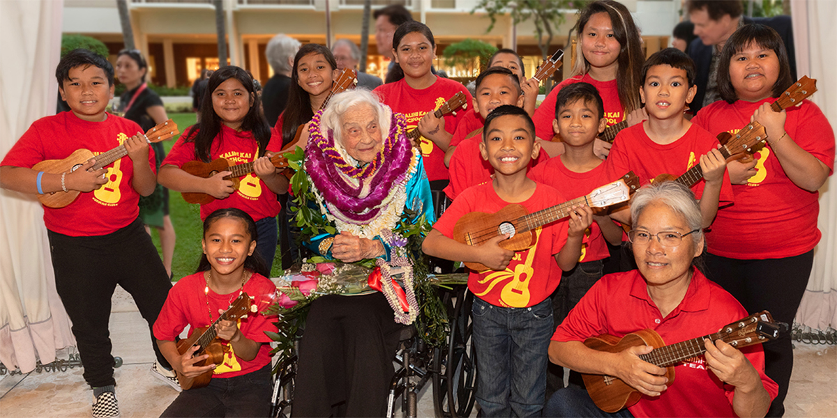 Barbara Smith and children playing ukulele